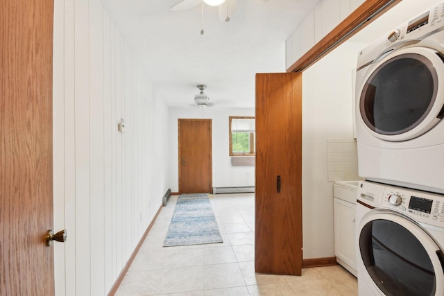 38413 N Tewes Ct, Beach Park, IL 60087 - washroom featuring stacked washer / drying machine, a baseboard radiator, light tile patterned floors, ceiling fan, and baseboards