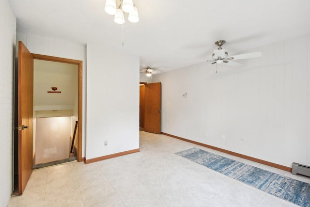 38413 N Tewes Ct, Beach Park, IL 60087 - spare room featuring a ceiling fan, a baseboard radiator, and baseboards