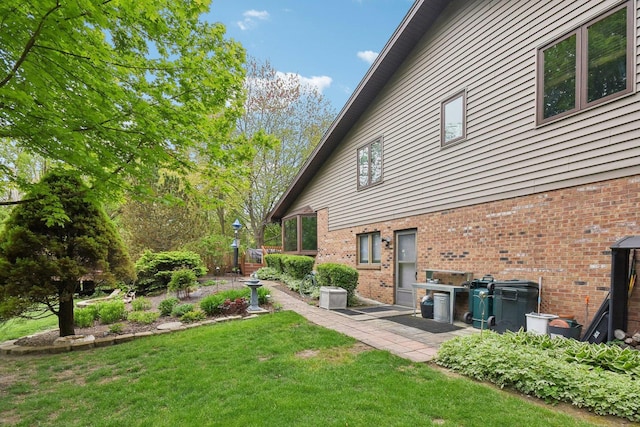 38413 N Tewes Ct, Beach Park, IL 60087 - view of grassy yard featuring a patio