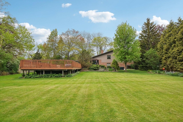 38413 N Tewes Ct, Beach Park, IL 60087 - view of grassy yard with a deck