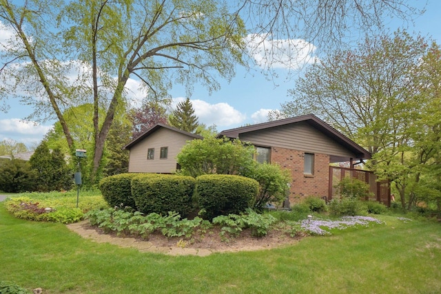 38413 N Tewes Ct, Beach Park, IL 60087 - view of property exterior with a lawn and brick siding