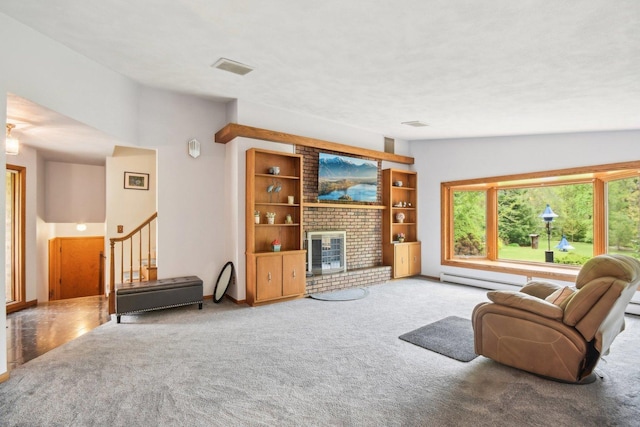 38413 N Tewes Ct, Beach Park, IL 60087 - living room featuring a baseboard heating unit, carpet, stairway, and a fireplace