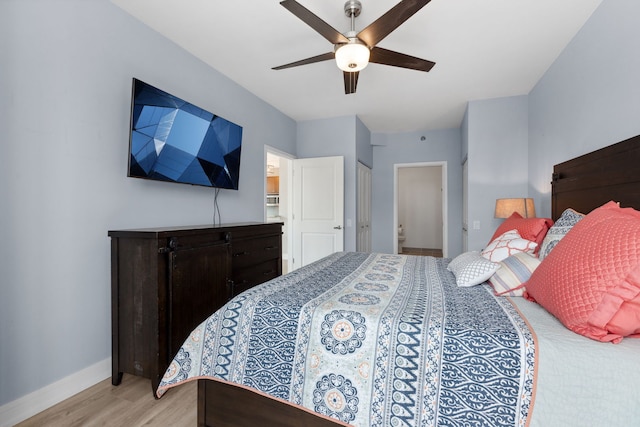 bedroom with baseboards, ceiling fan, and light wood finished floors