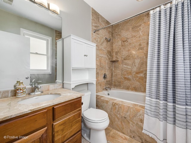 full bath with toilet, tiled shower / bath, and vanity
