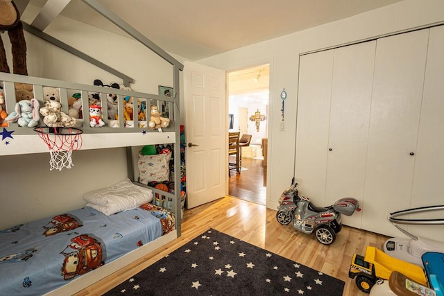 bedroom with a closet and wood finished floors