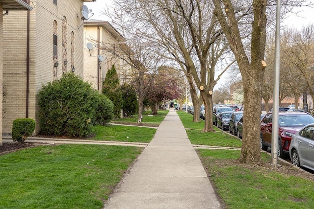 view of home's community featuring a yard