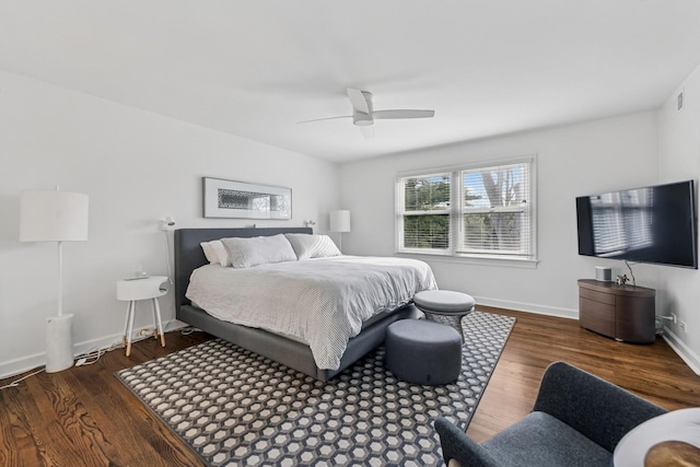 bedroom with baseboards, a ceiling fan, wood finished floors, and visible vents