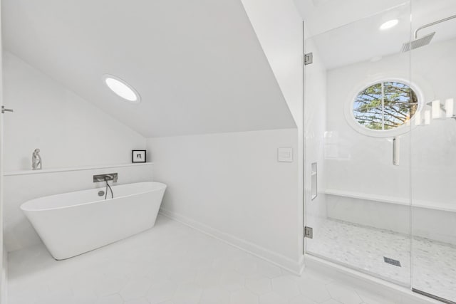 full bathroom with visible vents, lofted ceiling, tile patterned floors, a soaking tub, and a stall shower