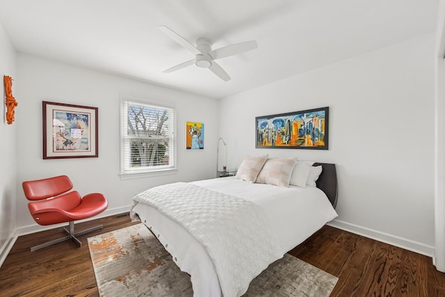 bedroom featuring baseboards, dark wood finished floors, and ceiling fan