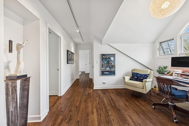 home office with baseboards, track lighting, and wood finished floors