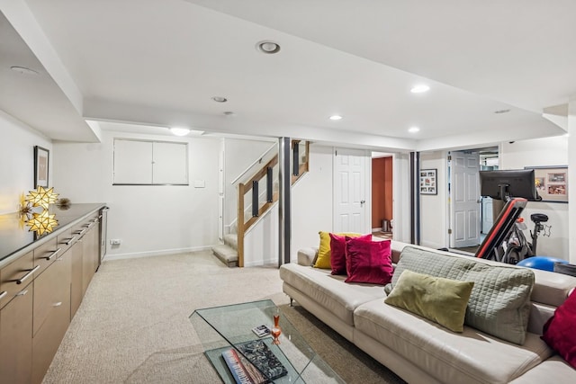 living room with stairs, recessed lighting, baseboards, and light carpet