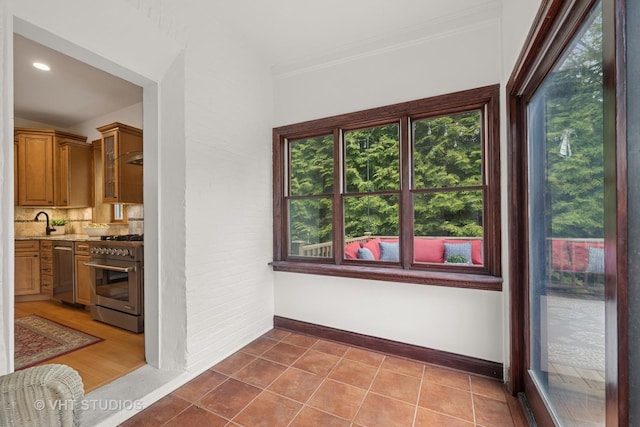 1625 Central Ave, Wilmette, IL 60091 - interior space with glass insert cabinets, baseboards, stainless steel appliances, and a wealth of natural light