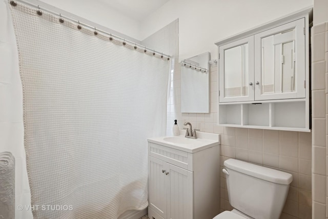 1625 Central Ave, Wilmette, IL 60091 - full bath with vanity, decorative backsplash, curtained shower, toilet, and tile walls