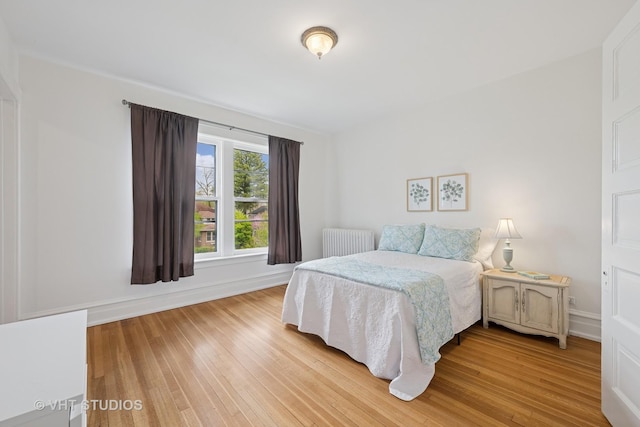 1625 Central Ave, Wilmette, IL 60091 - bedroom featuring light wood-type flooring, baseboards, and radiator heating unit