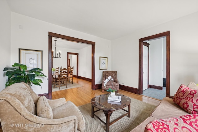 1625 Central Ave, Wilmette, IL 60091 - living area featuring baseboards, wood finished floors, and a notable chandelier