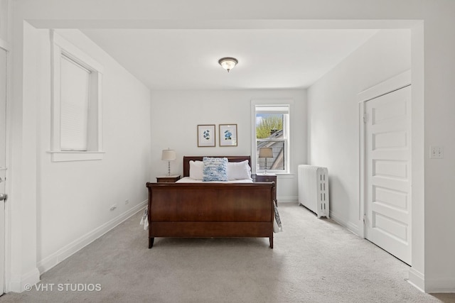 1625 Central Ave, Wilmette, IL 60091 - bedroom with radiator, baseboards, and light carpet