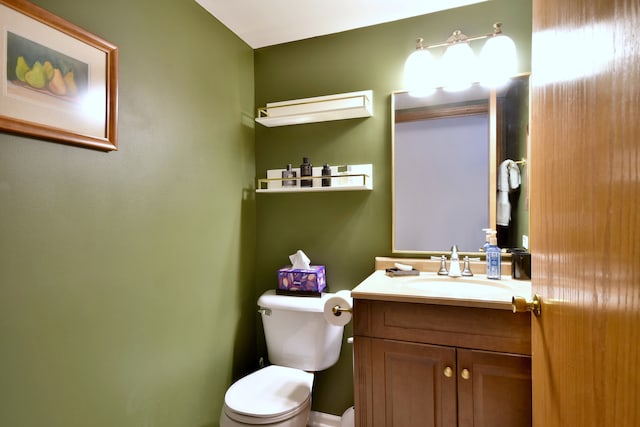 half bathroom with toilet and vanity