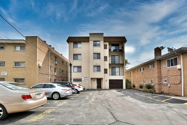 view of property featuring uncovered parking