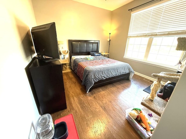 10817 Quail Xing, Richmond, IL 60071 - bedroom with visible vents, wood finished floors, and baseboards