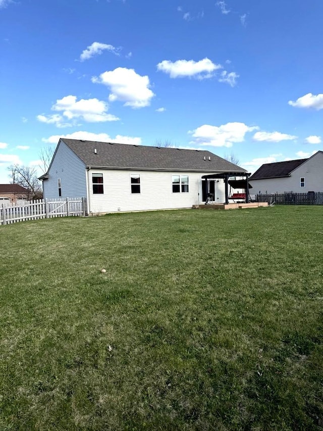 10817 Quail Xing, Richmond, IL 60071 - rear view of house featuring fence, a yard, and a patio