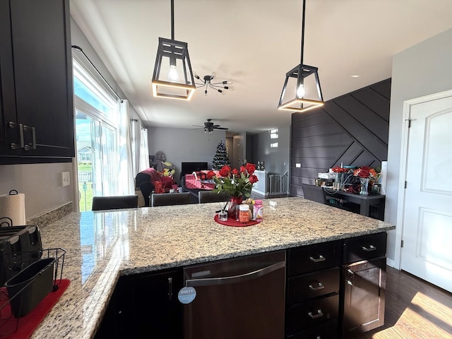 10817 Quail Xing, Richmond, IL 60071 - kitchen featuring a peninsula, dishwasher, dark cabinetry, a ceiling fan, and open floor plan
