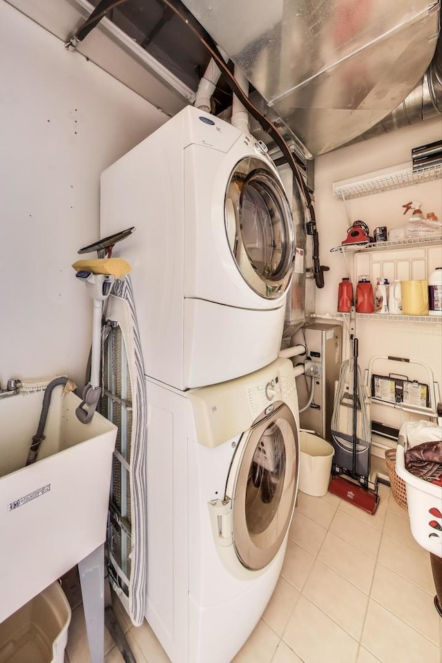 170 N NW Hwy Unit 410, Park Ridge, IL 60068 - laundry room with tile patterned floors, stacked washer / drying machine, laundry area, and a sink