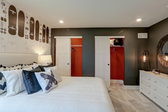 4314 Chelsea Manor Cir, Aurora, IL 60504 - bedroom with visible vents, baseboards, recessed lighting, light carpet, and two closets