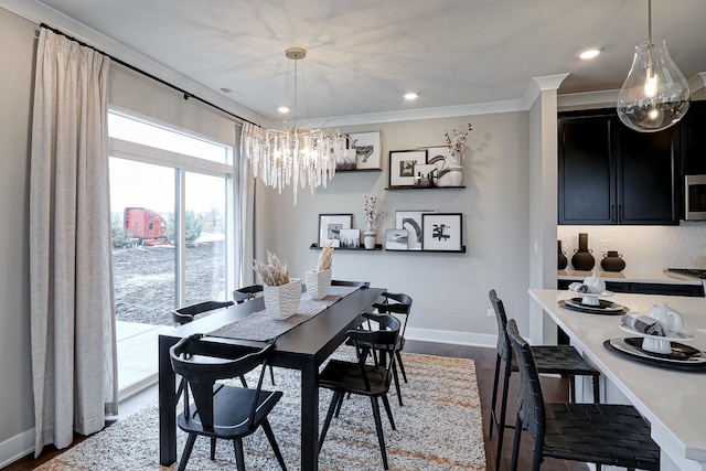 4314 Chelsea Manor Cir, Aurora, IL 60504 - dining space with recessed lighting, an inviting chandelier, dark wood-type flooring, baseboards, and crown molding