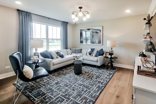 living area featuring baseboards, recessed lighting, and wood finished floors