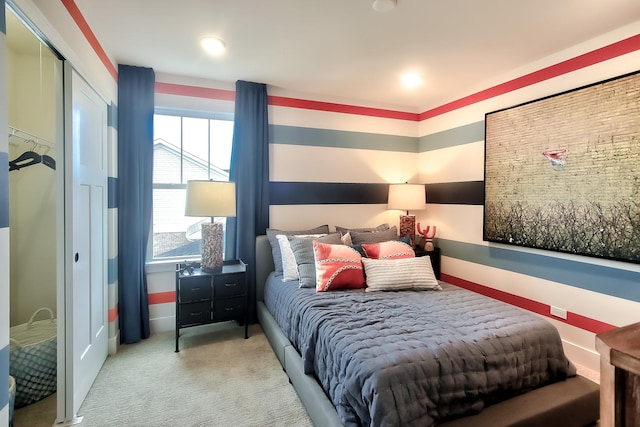 bedroom featuring baseboards and light carpet