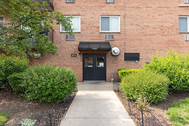 1056 N Mill St Unit 306, Naperville, IL 60563 - property entrance featuring brick siding and french doors