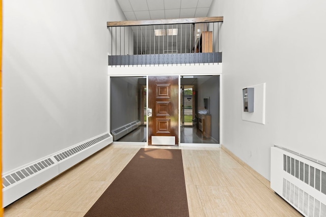 1056 N Mill St Unit 306, Naperville, IL 60563 - entrance to property featuring radiator heating unit and a baseboard radiator
