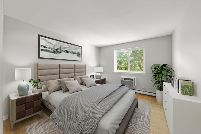 1056 N Mill St Unit 306, Naperville, IL 60563 - bedroom featuring a wall mounted air conditioner, a baseboard heating unit, and light wood-type flooring