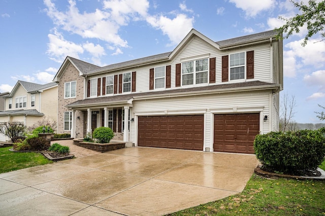 view of front of property featuring an attached garage and driveway