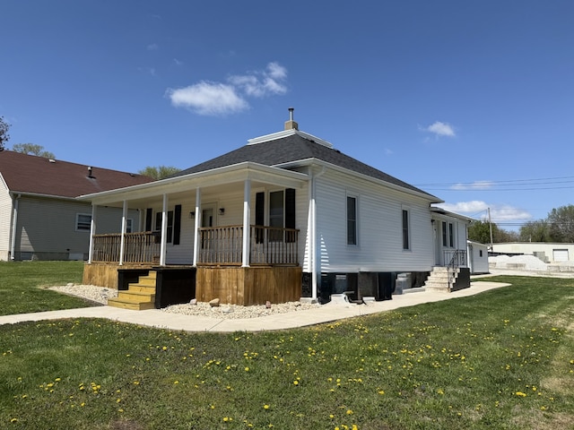 exterior space featuring entry steps, a porch, and a front yard