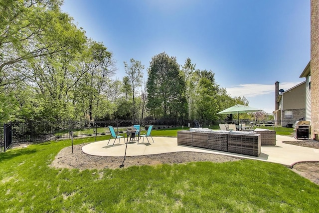 view of yard featuring an outdoor living space and a patio area