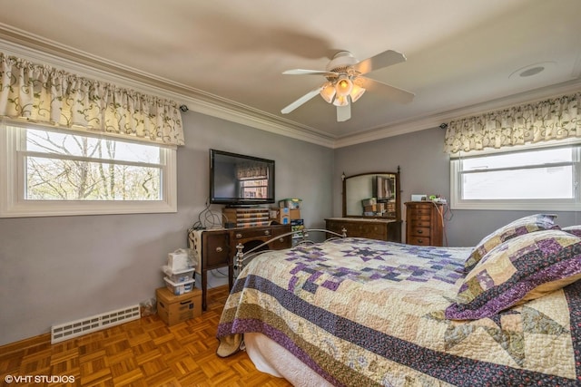bedroom featuring crown molding, a ceiling fan, and visible vents