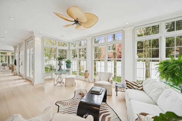 sunroom with a healthy amount of sunlight and french doors