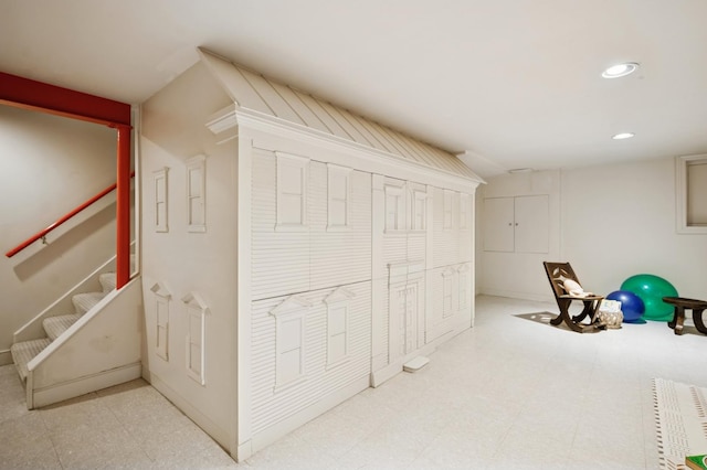 interior space with tile patterned floors, stairway, and recessed lighting