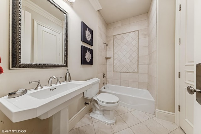 bathroom with shower / bath combination, toilet, tile patterned flooring, and baseboards