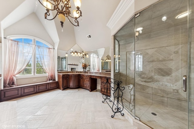 bathroom featuring a stall shower, a notable chandelier, lofted ceiling, and visible vents