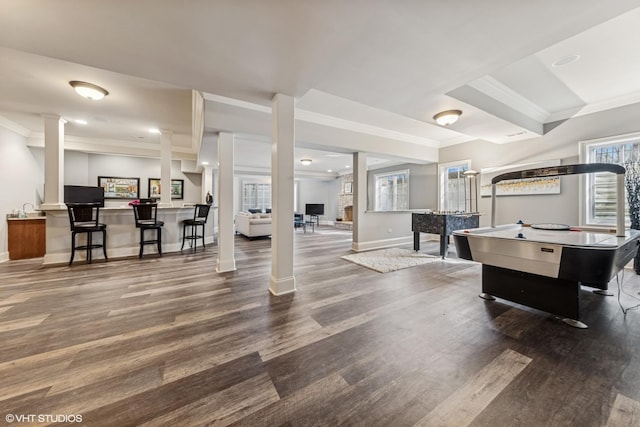 recreation room with wood finished floors, recessed lighting, ornamental molding, and baseboards