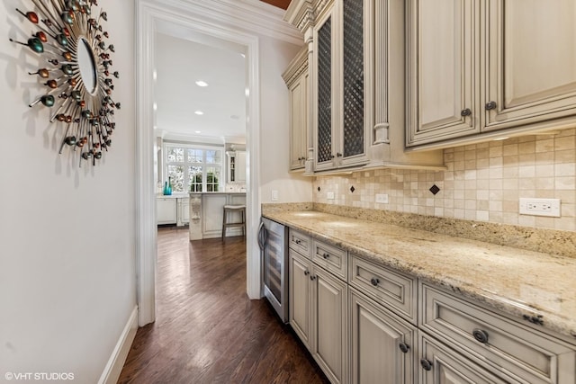 bar featuring ornamental molding, wine cooler, backsplash, and dark wood-type flooring