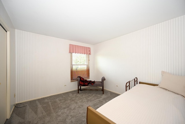 bedroom with carpet flooring and baseboards