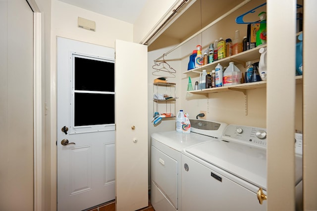 clothes washing area with washing machine and clothes dryer