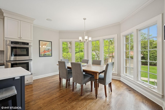 495 Willow Rd, Winnetka, IL 60093 - dining room featuring a chandelier, baseboards, plenty of natural light, and crown molding
