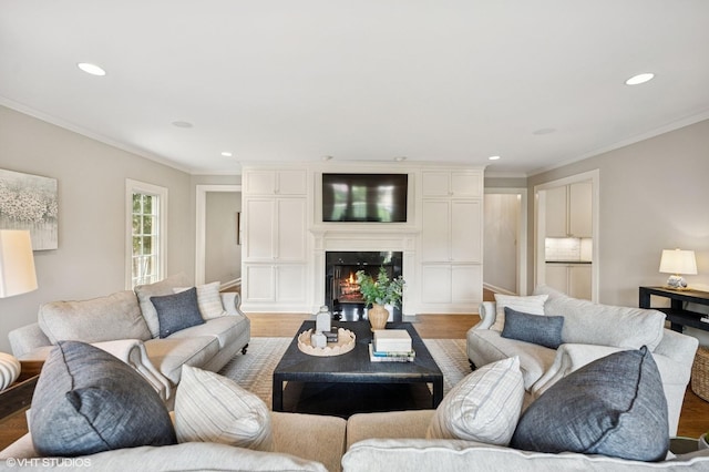 495 Willow Rd, Winnetka, IL 60093 - living area featuring light wood-style floors, recessed lighting, ornamental molding, and a glass covered fireplace