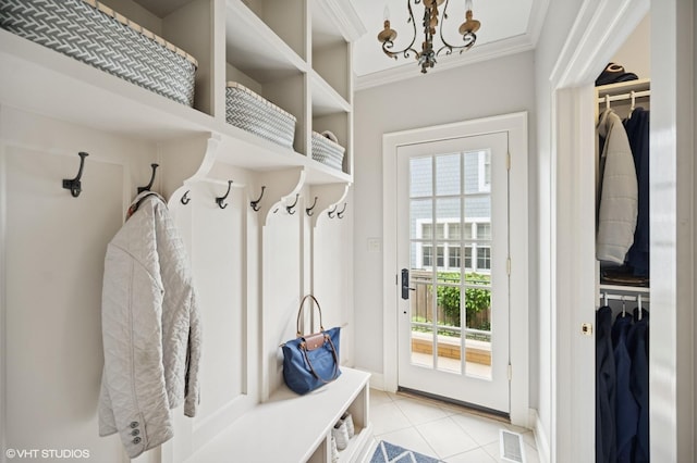 495 Willow Rd, Winnetka, IL 60093 - mudroom with light tile patterned floors, a chandelier, and crown molding