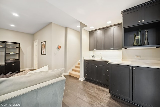 495 Willow Rd, Winnetka, IL 60093 - kitchen with wood finished floors, baseboards, recessed lighting, light countertops, and open floor plan
