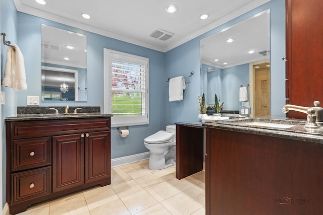 full bathroom with crown molding, toilet, two vanities, and a sink